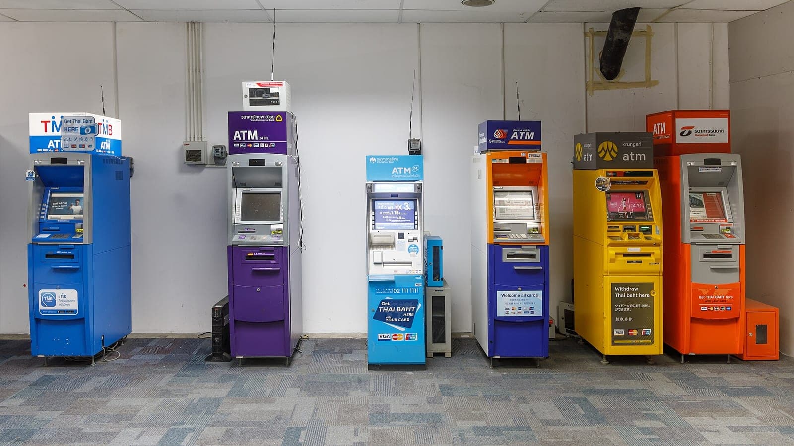 Row of Thai bank ATMs at Phuket International Airport